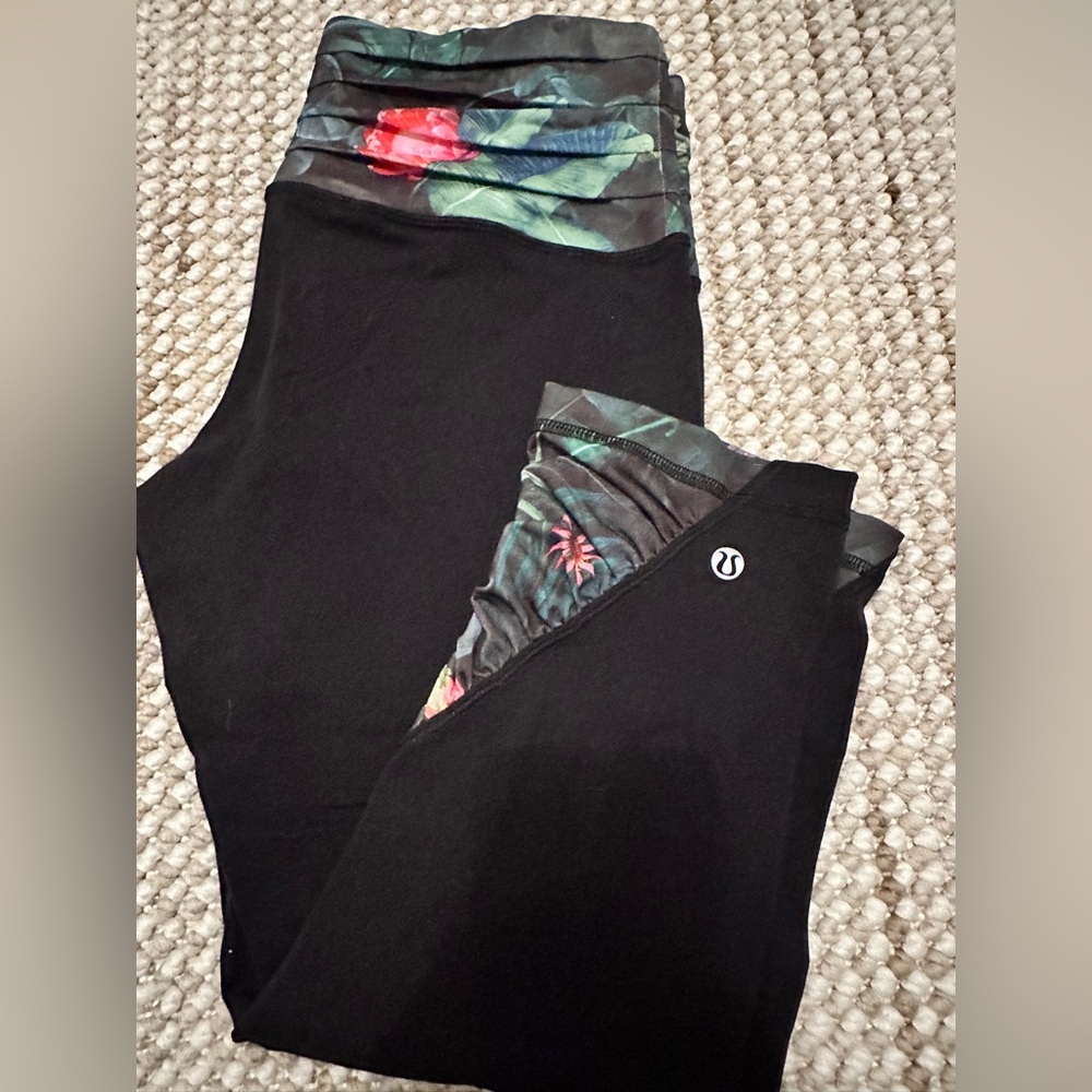 Lululemon Black Leggings with Floral waist band and on the bottom